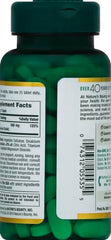 Nature's Bounty magnesium-coated tablets close-up, smooth coating for easy swallowing.
