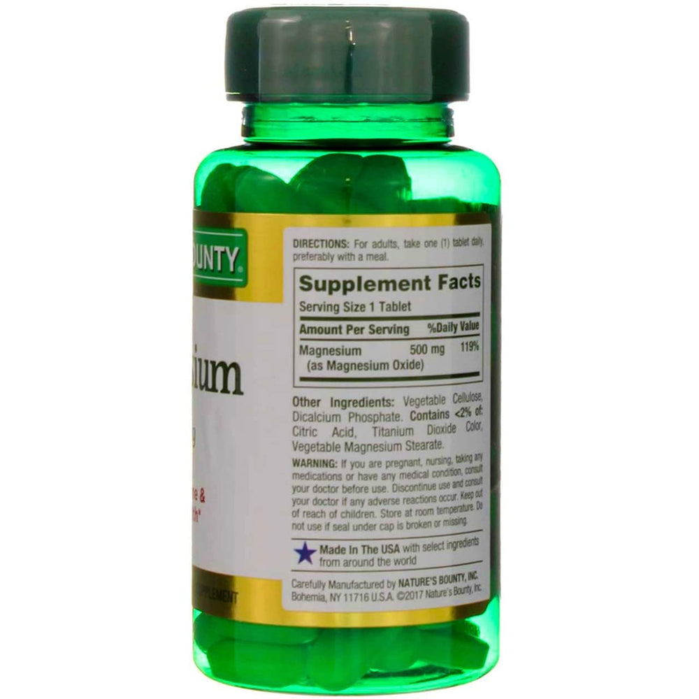 Nature's Bounty magnesium tablets in hand, convenient daily supplement.