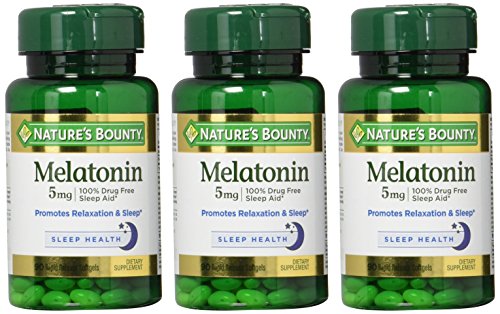 Nature's Bounty Melatonin bottle open pour with tablets ready for bedtime