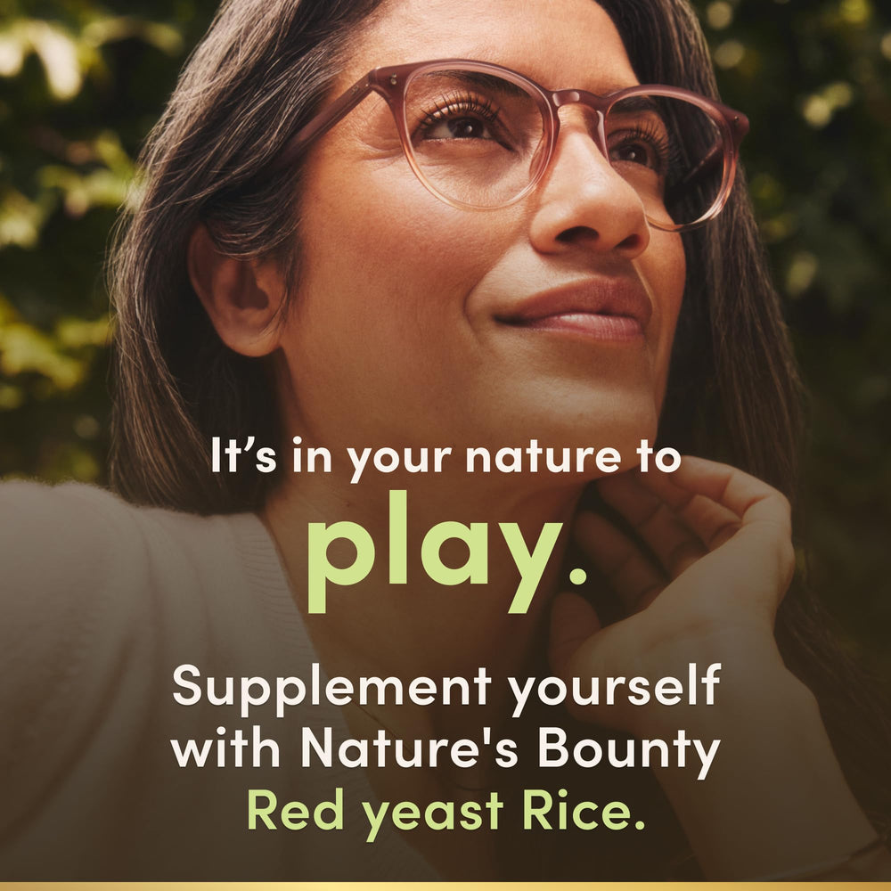 Nature's Bounty Red Yeast Rice capsules bottle on shelf in a clean setting