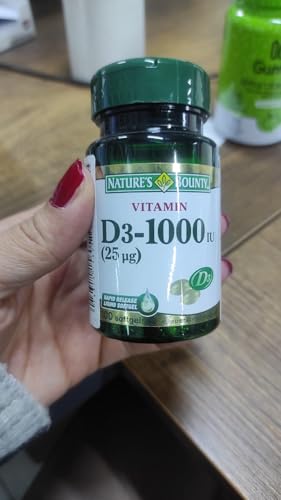 Pouring Nature's Bounty Vitamin D3 1000 soft gels for easy daily dosing