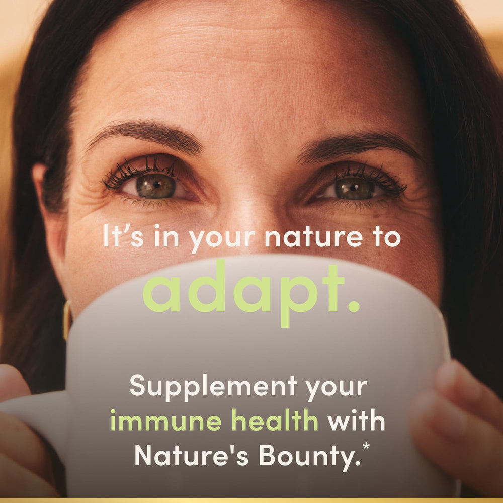 Nature's Bounty Vitamin E bottle on shelf highlights gluten-free and preservative-free quality.
