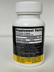 Close-up of Nature's Fusions KI tablets ready for precise dosing.