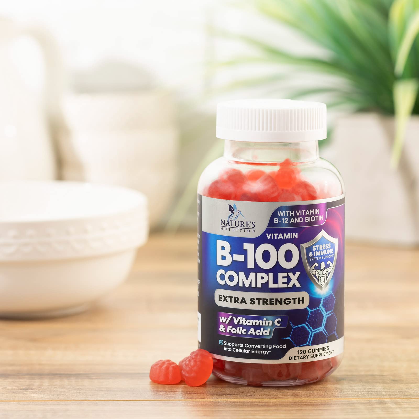 Nature's Nutrition B Complex Gummies being taken with water during a morning routine