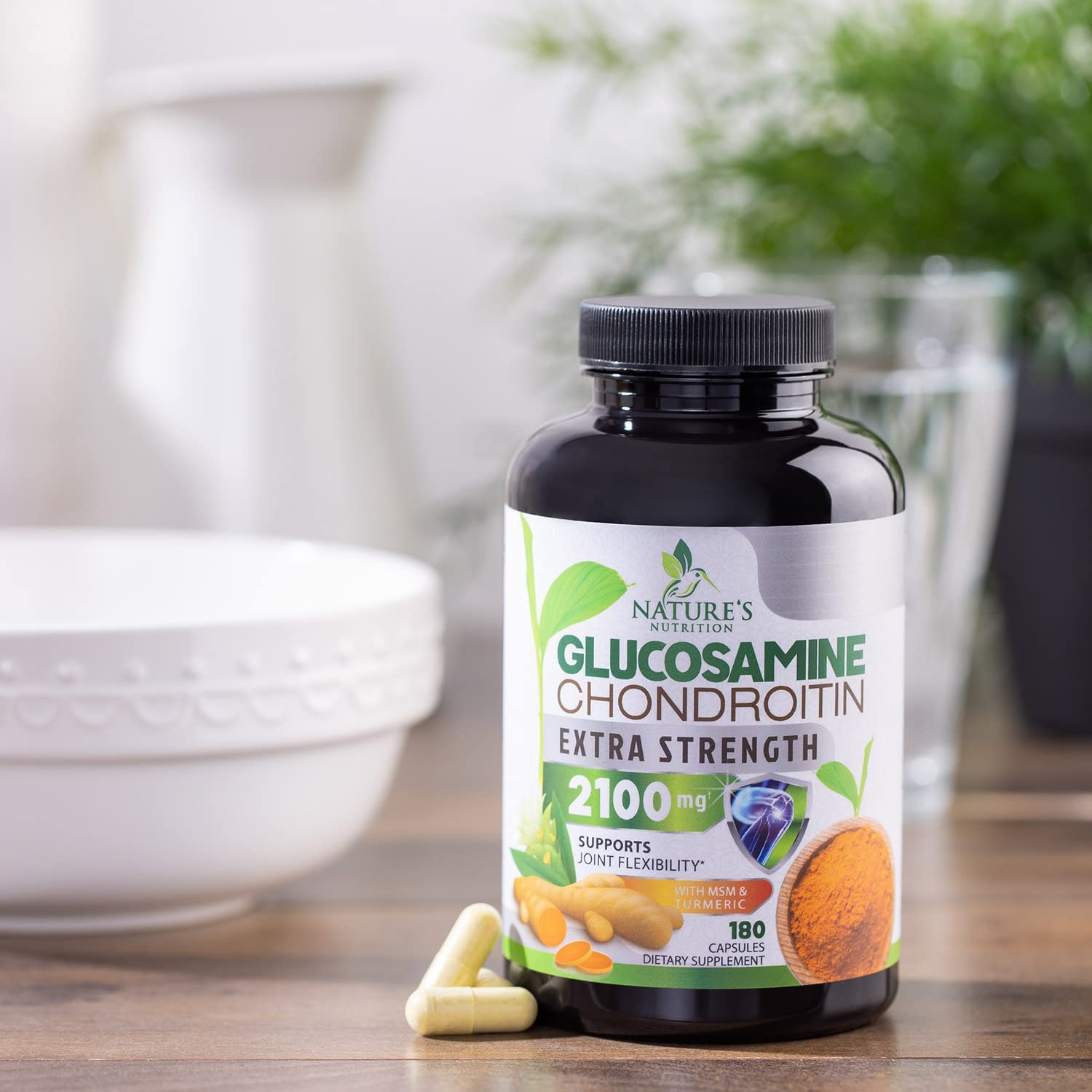 Nature's Nutrition bottle with fitness gear in background