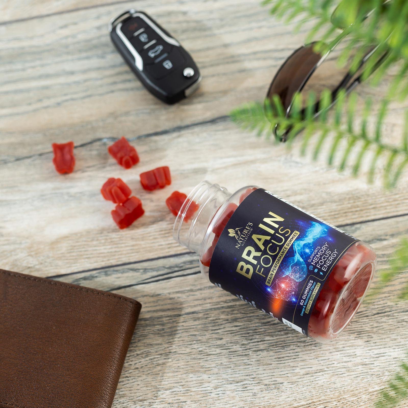 Nature's Nutrition gummies in hand imply convenient memory and focus boost