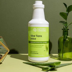 Pouring Nature's Sunshine Aloe Vera Juice into a glass for easy daily consumption