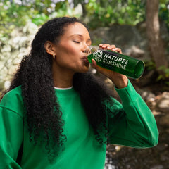 Glass of water with chlorophyll sticks for a vibrant daily drink