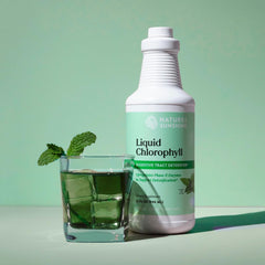 Nature's Sunshine Liquid Chlorophyll drops being poured, spearmint aroma for refreshing flavor.