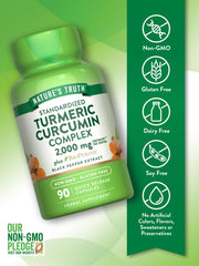 Nature's Truth Turmeric Curcumin bottle on kitchen counter with glass of water