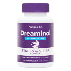 NaturesPlus DREAMINOL Stress and Sleep Complex bottle on a nightstand for a calming nightly routine