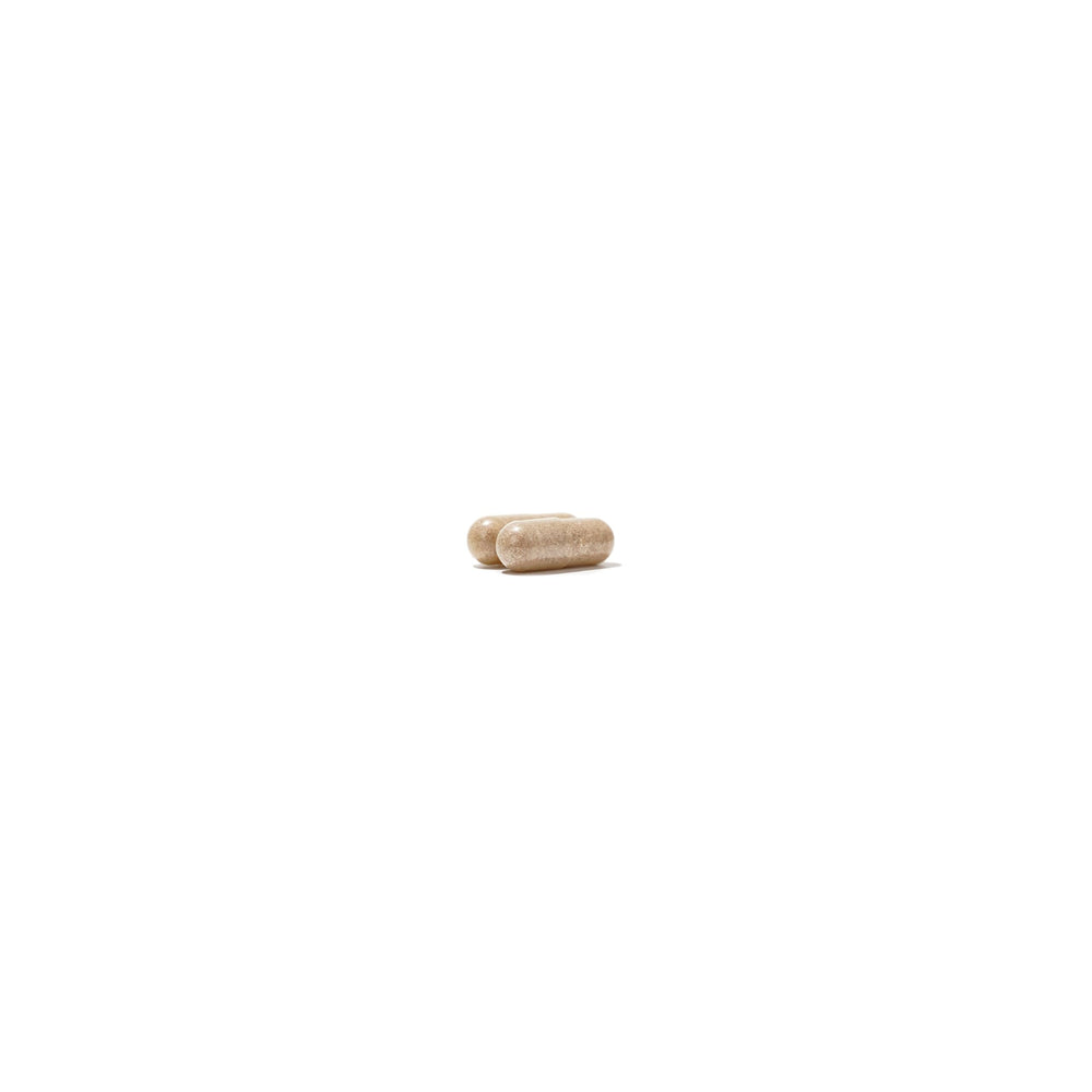 NatureWise NightTime Fitness capsule resting beside clock hints at potential sleep-friendly routine.