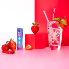 Close-up of HydroMATE strawberry powder dissolving in water.