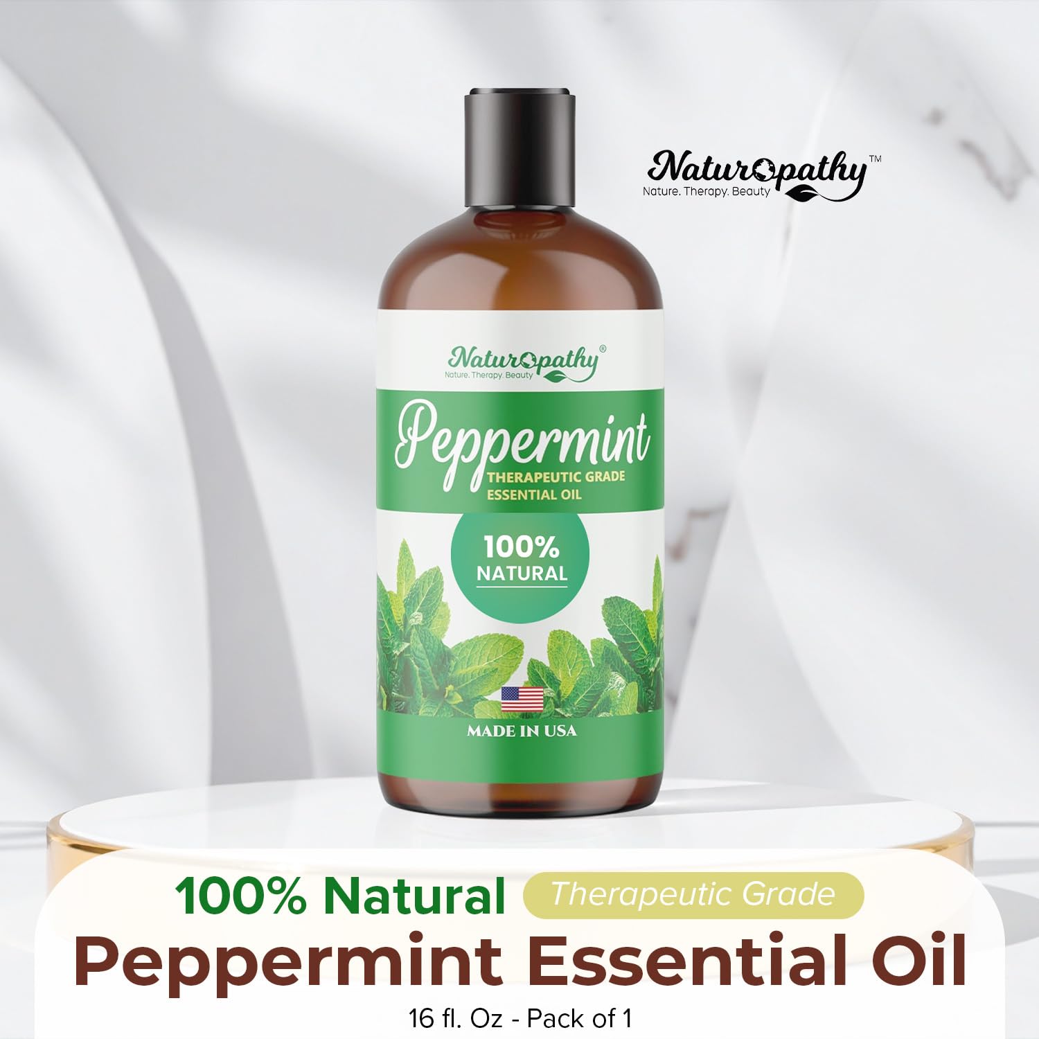 NATUROPATHY peppermint essential oil bottle label highlights purity and quality guarantee.