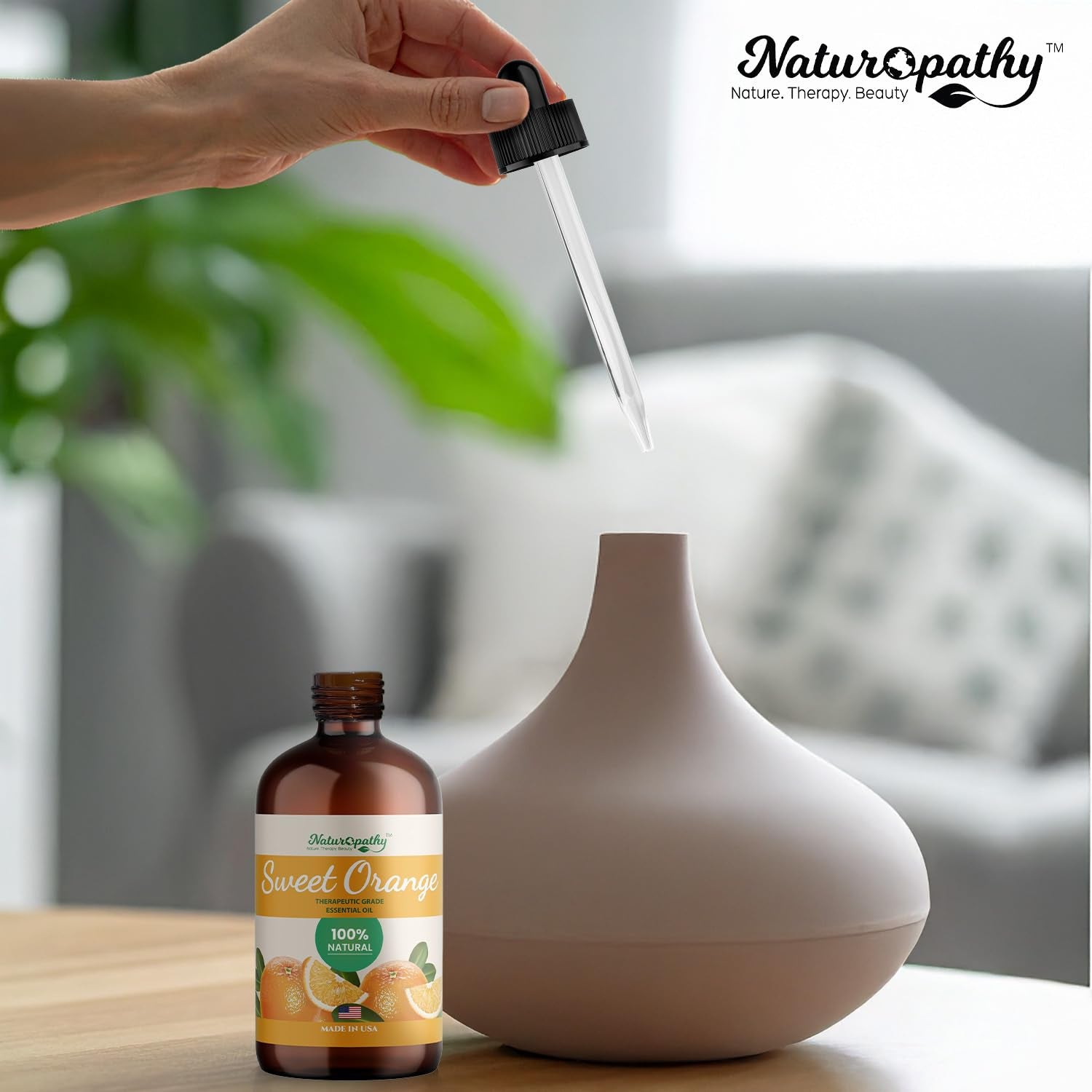 Packaging display of NATUROPATHY Sweet Orange Oil in 4 oz size
