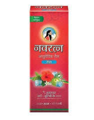 Close-up of Navratna oil pouring for soothing scalp relief.