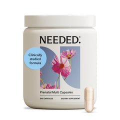 Needed multivitamin bottle closeup highlighting 26 nutrients for prenatal support.