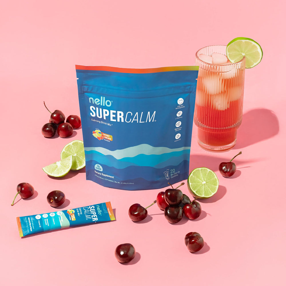 Nello SuperCalm powder swirls into a glass for a cherry limeade moment.