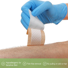 NeuHeils large panel bandage being applied on arm for secure protection