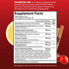 Pouring NEW AGE berberine drops into a glass of water for convenient daily intake