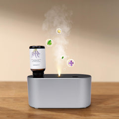Nexalithron waterless diffuser in silver on desk delivering subtle home fragrance