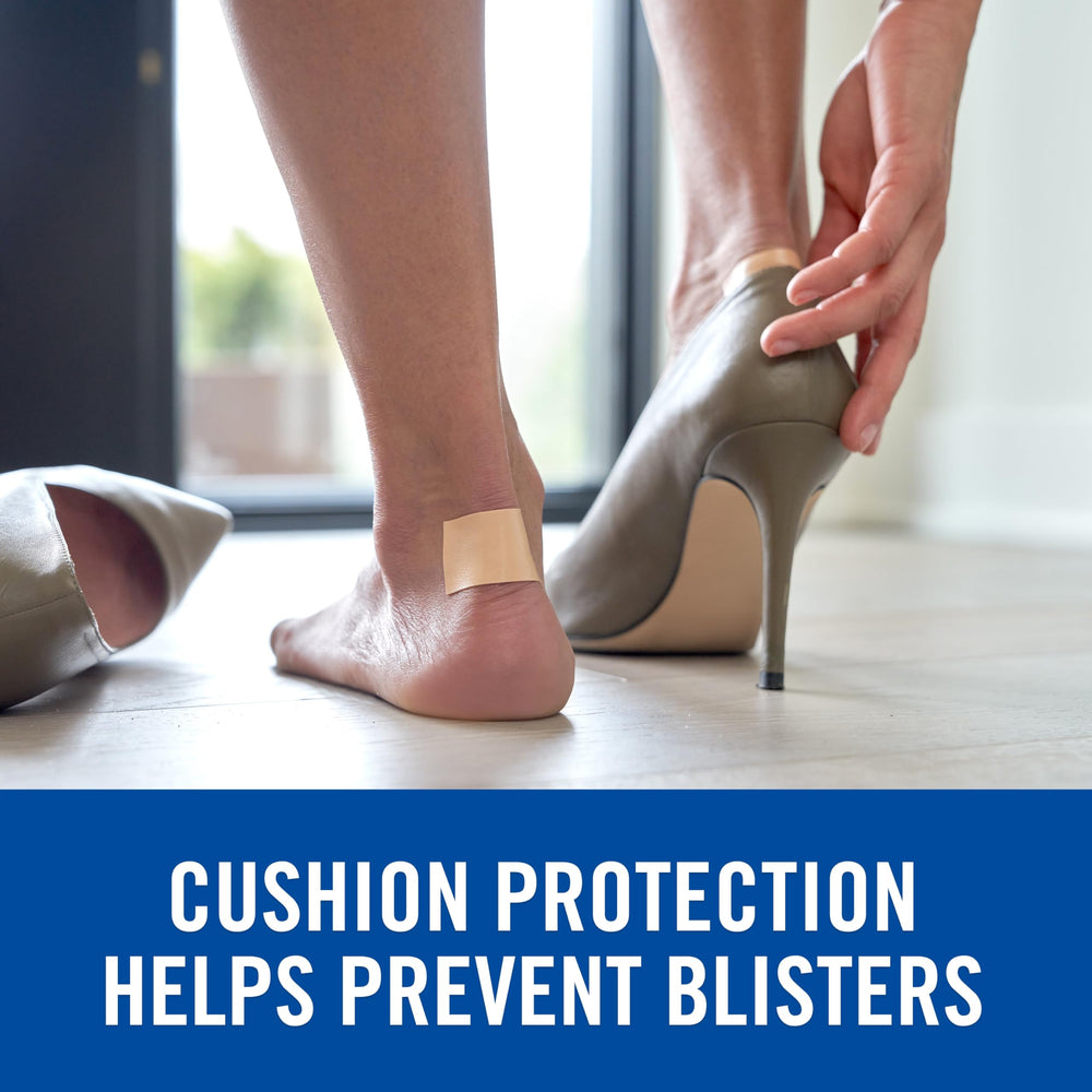 Nexcare Absolute Waterproof Tape on wet skin secures dressings during swimming.