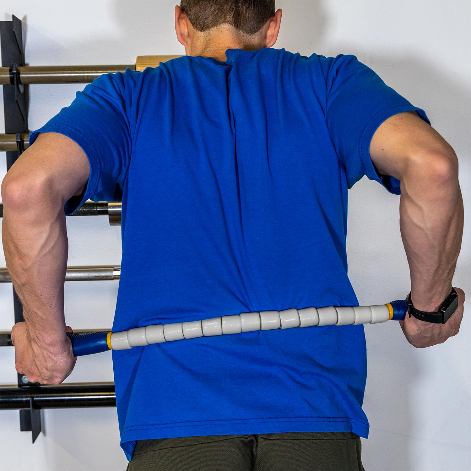 Leg and quad massage with the Nine for Nine 24-inch stick for recovery.