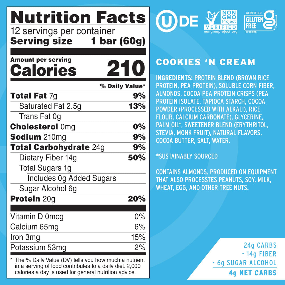 No Cow Upgraded Cookies N Cream bar close-up with crunchy cookie pieces and creamy center