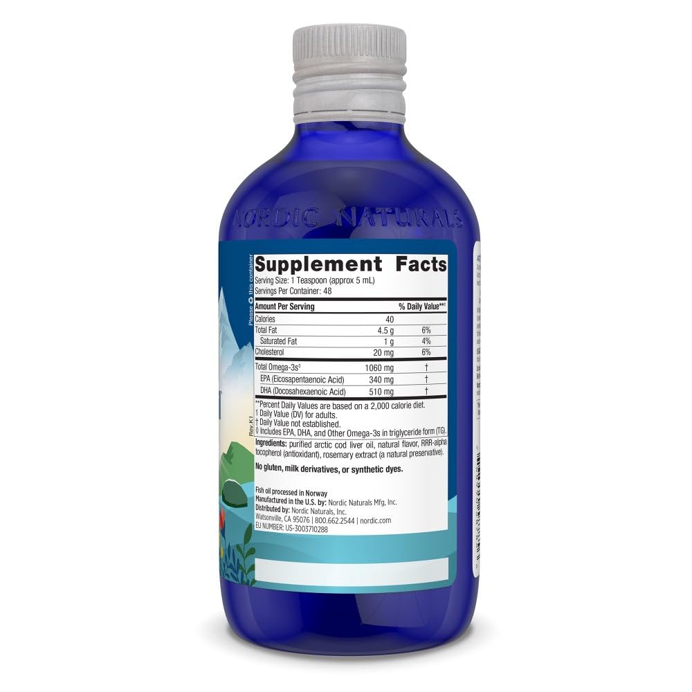 Pouring Nordic Naturals Arctic Cod Liver Oil Lemon from the bottle.