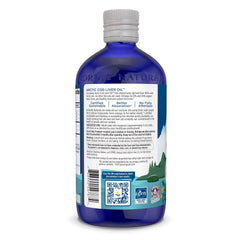 Orange liquid being poured from Nordic Naturals bottle for easy dosing