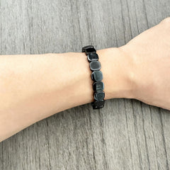 NORLSO hematite bracelet worn on wrist demonstrates masculine style and subtle edge.