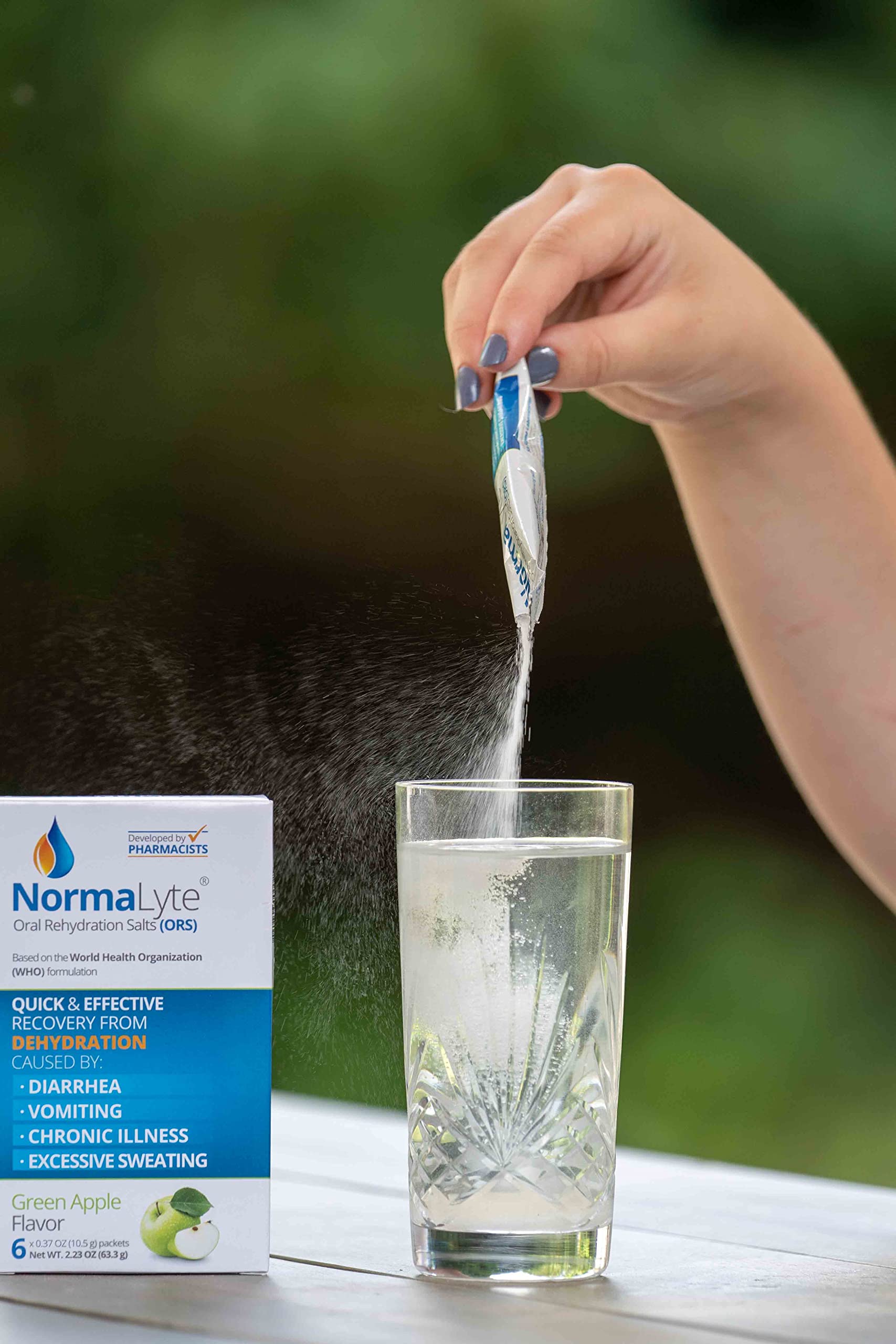 NormaLyte Orange on-the-go user preparing hydration during activity.