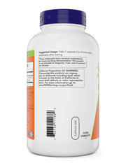 NOW Cayenne capsules pour from bottle, showing convenient daily dosing after meals.