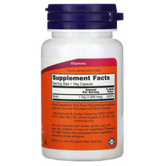 NOW Foods Biotin 1000 mcg capsule close-up showing small smooth pill.