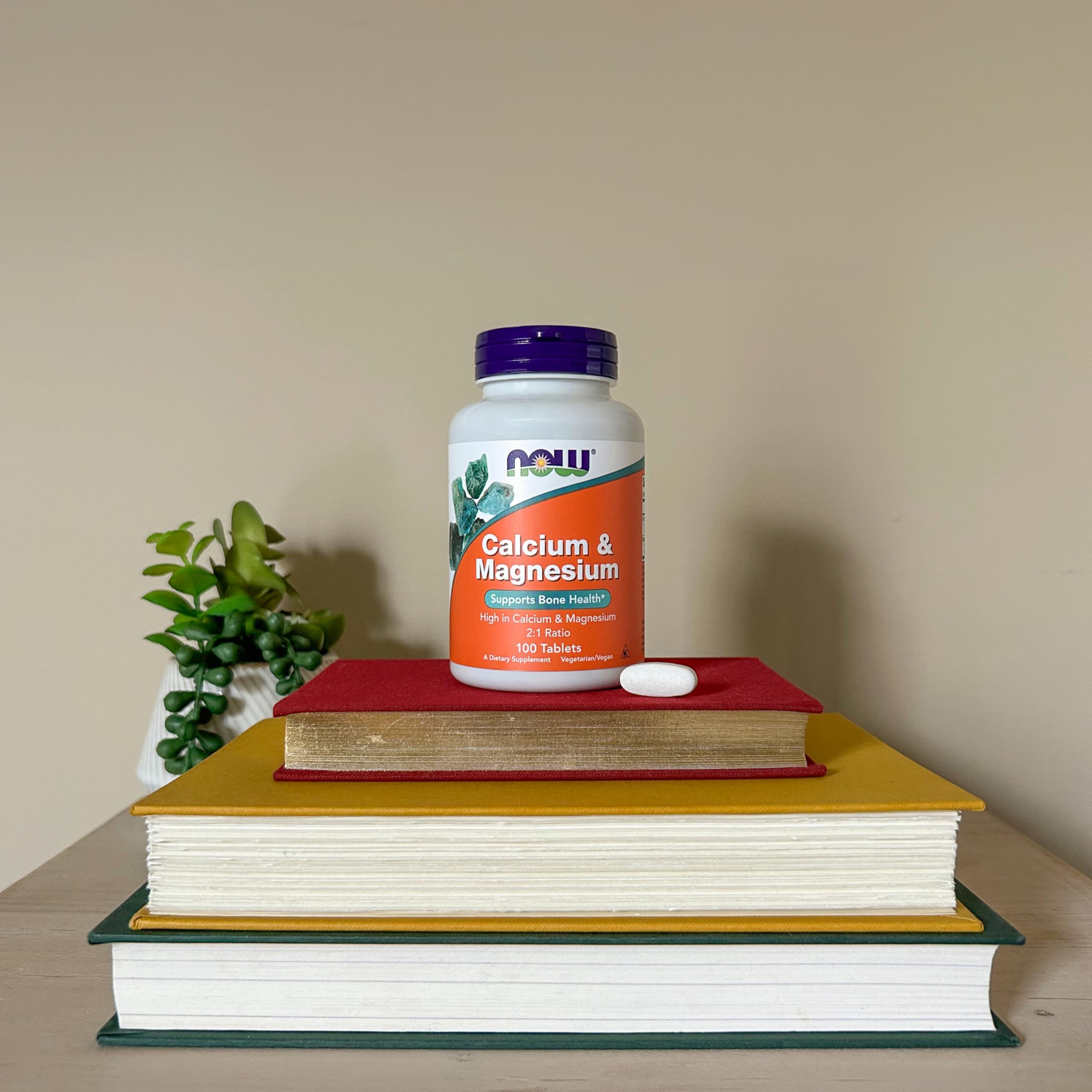 NOW Foods calcium-magnesium GMP-quality badge reflects rigorous testing and third-party certification for quality.