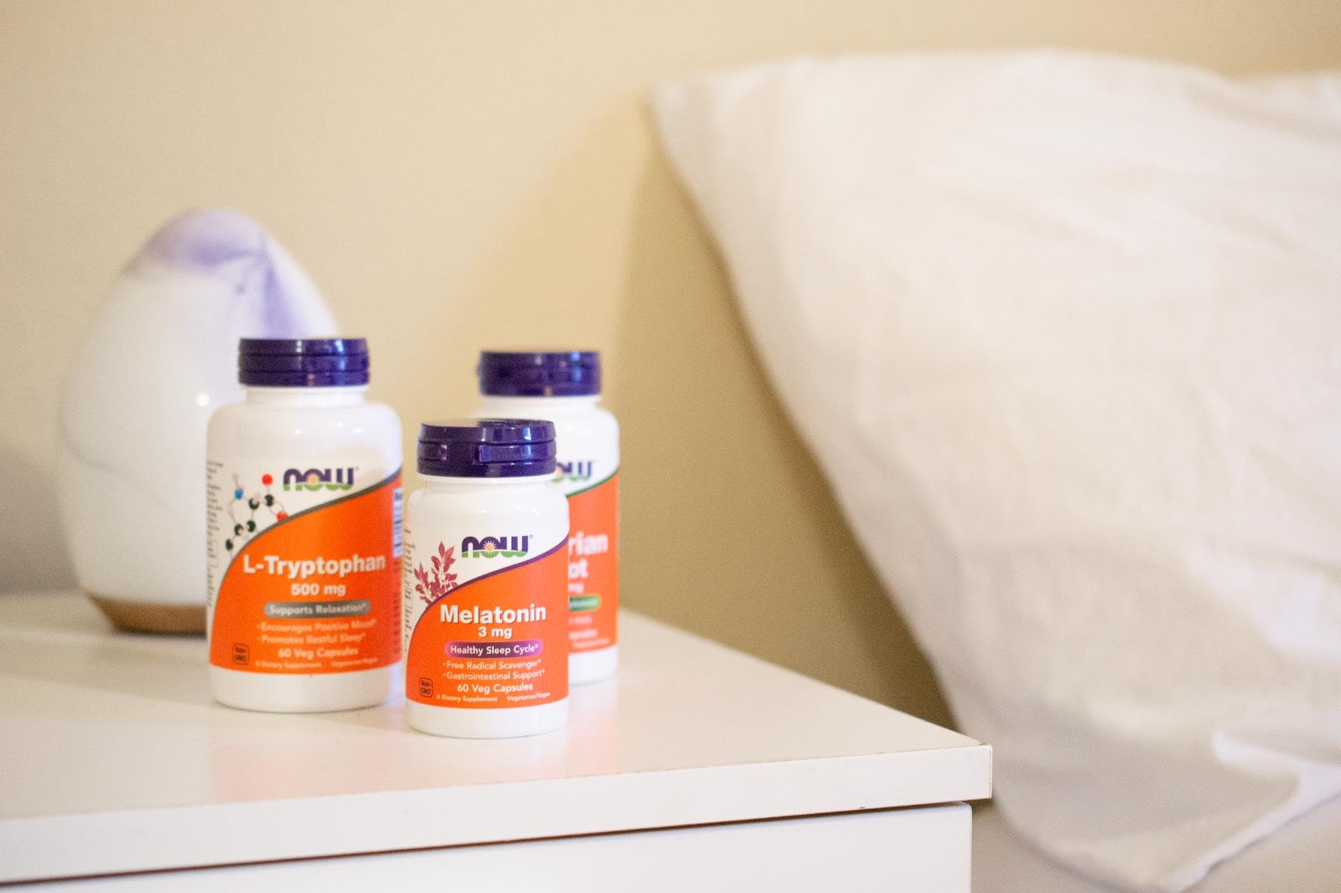 NOW Foods L-Tryptophan supplements arranged in a tidy routine.