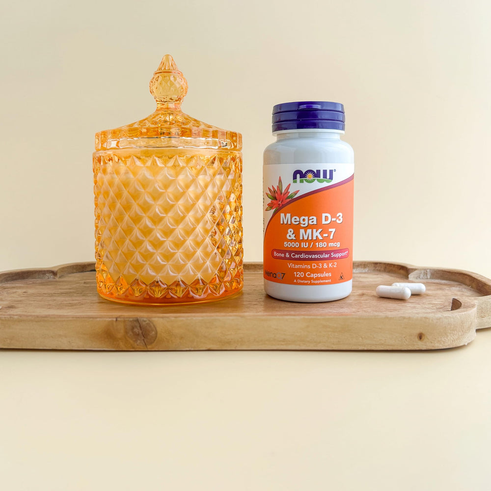 NOW Foods Mega D3 & MK-7 bottle pour showing easy-to-take capsules.