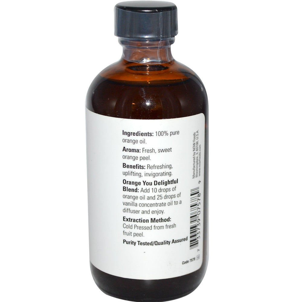 NOW Foods Orange Essential Oil label close-up showing product details and aroma.