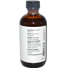 NOW Foods Orange Essential Oil label close-up showing product details and aroma.