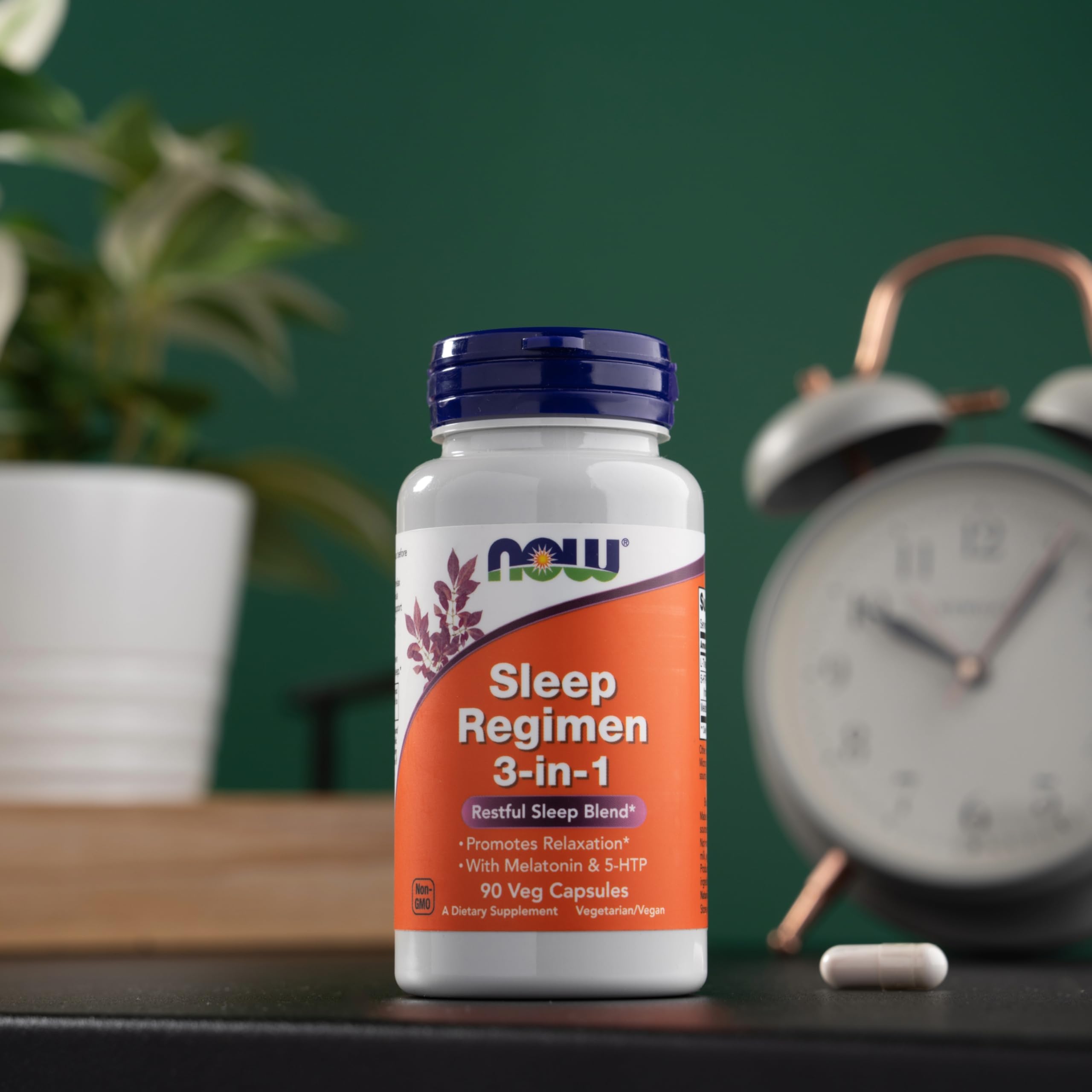 NOW Foods Sleep Regimen capsules poured into hand for easy dosing