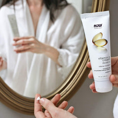 NOW Foods Vitamin E Cream jar close-up emphasizing the nourishing formula
