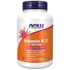 NOW Foods Vitamin K-2 250 bottle on table with capsules for bone support