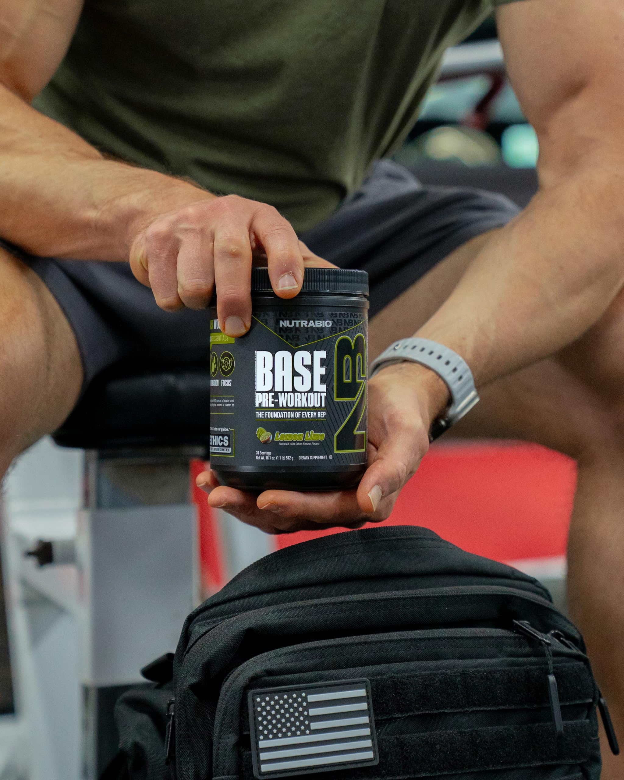 Athlete mid-set using NutraBio Base Pre-Workout — potential endurance and focus boost.