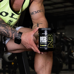 NutraBio Base Pre-Workout powder mix in lemon lime — ready for intense training.