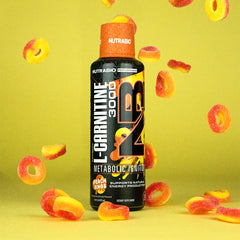 NutraBio L-Carnitine Liquid Shots peach rings glass, flavorful pre-workout option.