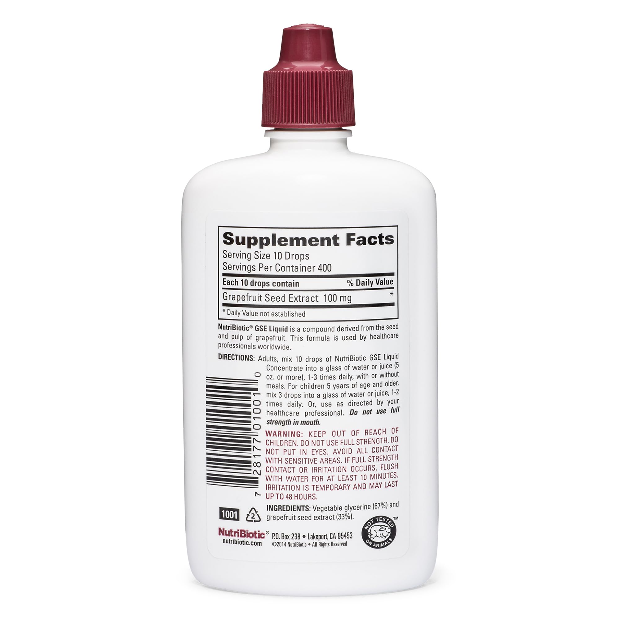 NutriBiotic GSE bottle pour demonstrates easy dosing in a glass