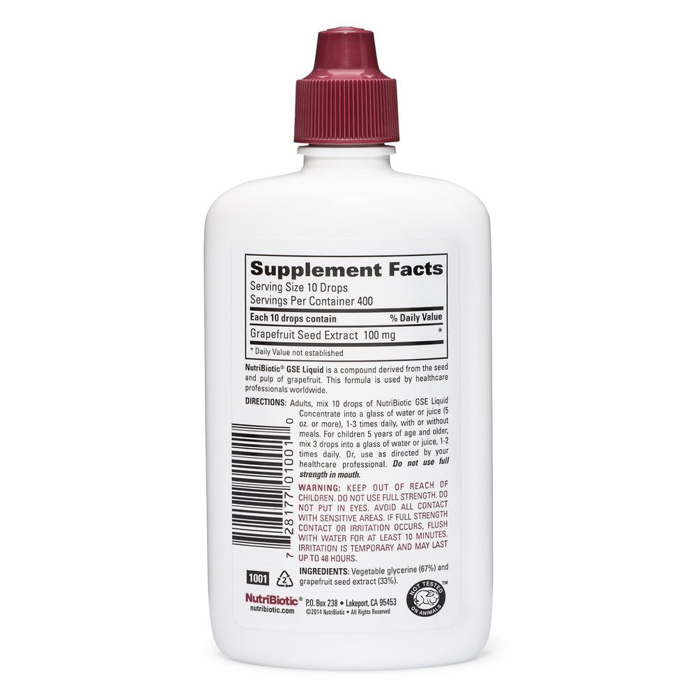 NutriBiotic GSE bottle pour demonstrates easy dosing in a glass