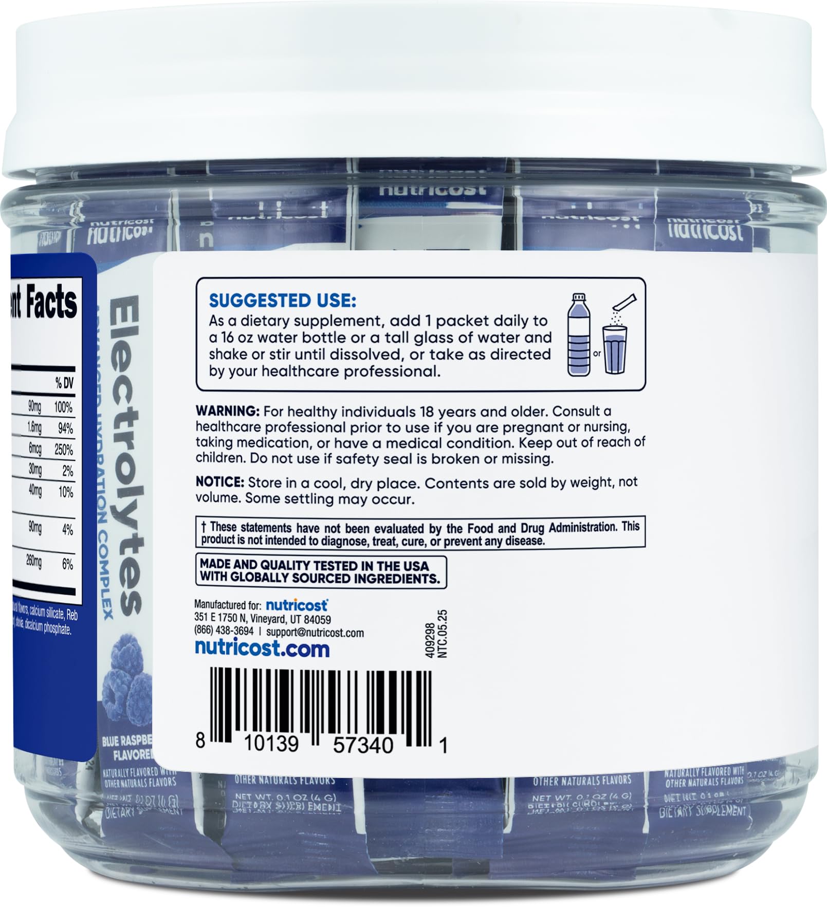 Glass of water with Nutricost Electrolytes Blue Raspberry ready to mix