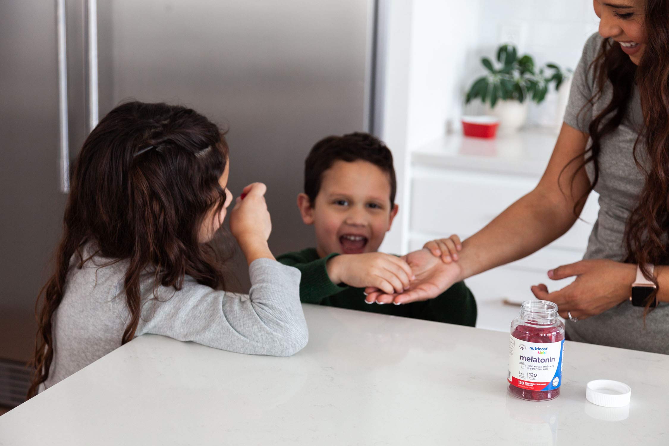 Nutricost Kids Melatonin Gummies 120-count bottle contents visible.