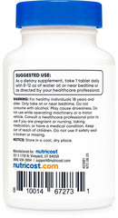 Nutricost Melatonin bottle with glass of water, ideal for bedtime routines.